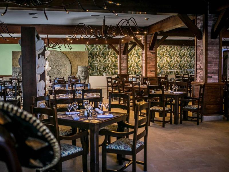 Cozy restaurant with wooden furniture and decorative ambiance for guests.