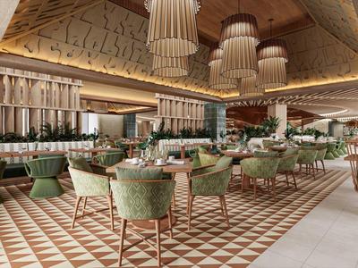 Ruime restaurantruimte met decoratieve lampen, groene stoelen en een patroon op de vloer.