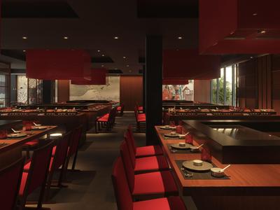 Modernes, stilvolles Restaurant mit roten Stühlen und gedämpfter Beleuchtung.