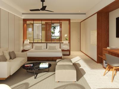 Modern eingerichtetes Wohnzimmer mit Sofa, Couchtisch, Schreibtisch und Fernseher an der Wand.