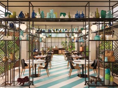 Restaurant moderne avec sol géométrique turquoise-blanc et étagères décoratives