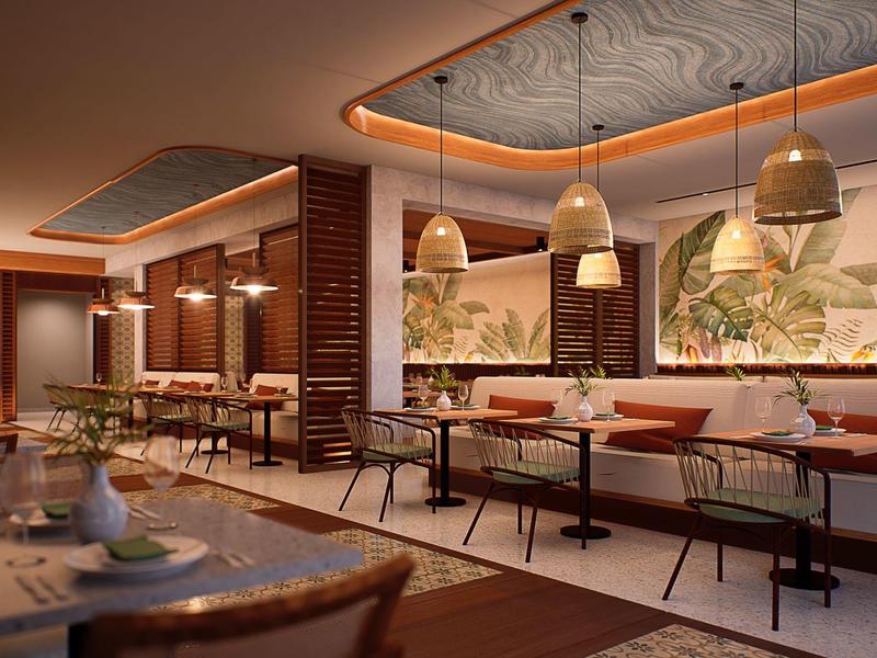 Warm verlichte hotelrestaurant met houten accenten, comfortabele zitplaatsen en artistieke wanddecoratie.