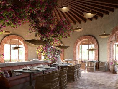 Gemütlicher Gastraum mit Holzmöbeln, großen Blumenarrangements und gewölbter Decke.