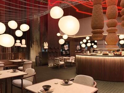 Interiér moderní restaurace s kulovitým zavěšeným osvětlením a útulnou výzdobou.