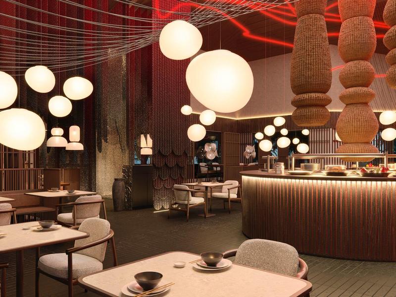 Interiér moderní restaurace s kulovitým zavěšeným osvětlením a útulnou výzdobou.