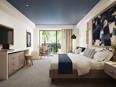 Habitación de hotel moderna con cama doble, TV, balcón y decoración elegante.