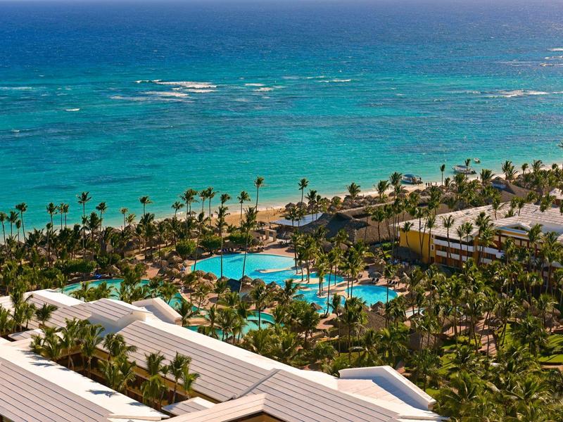 Buffet room with long, colorful buffet stations and various dishes in a modern hotel.