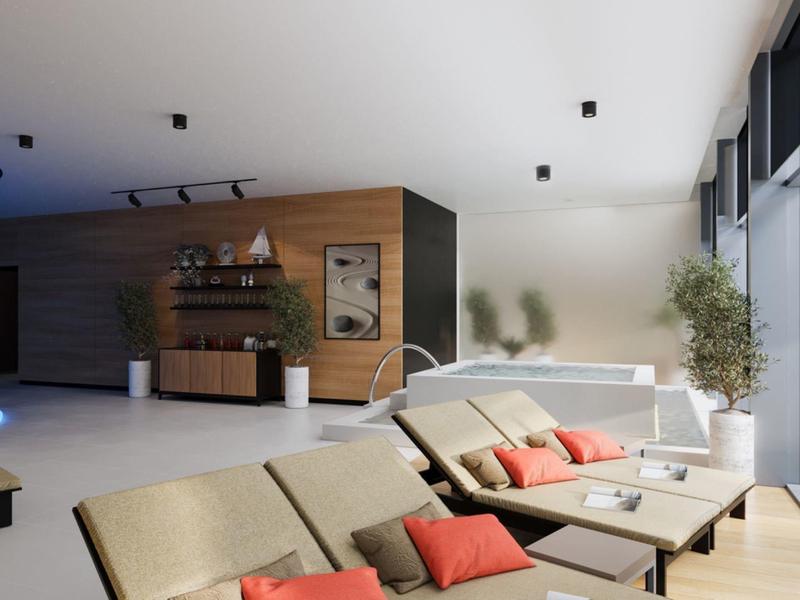 Moderní obývací pokoj s pohodlnými křesly, polštáři a velkým oknem s výhledem na terasu.