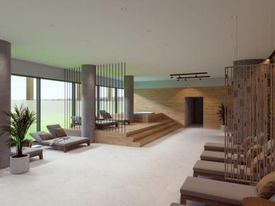 Área de bienestar moderna y luminosa con tumbonas y grandes ventanas que crean un ambiente relajante.