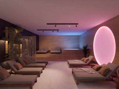 Sala de relajación de spa moderna con cómodas tumbonas y iluminación ambiental LED.