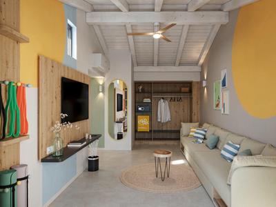 Chambre d'hôtel moderne avec canapé, décoration murale et garde-robe ouverte aux tons clairs.