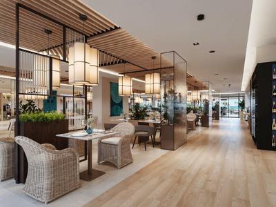 Modernes, helles Restaurant mit Holzfußboden und Korbsesseln im Hotel.