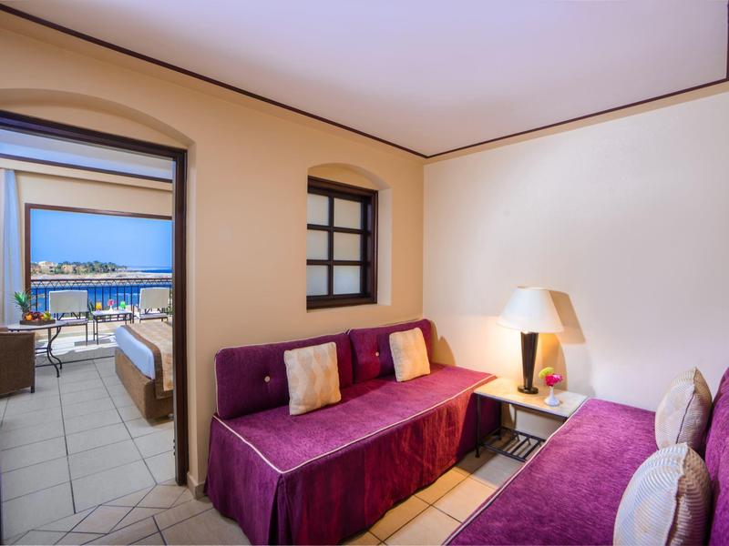 Cozy room with two sofas and a balcony overlooking the sea.