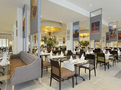 Bright restaurant with modern furniture and set tables in an elegant atmosphere.