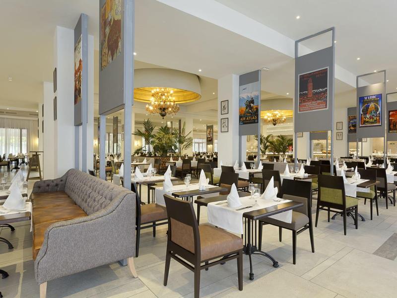 Bright restaurant with modern furniture and set tables in an elegant atmosphere.