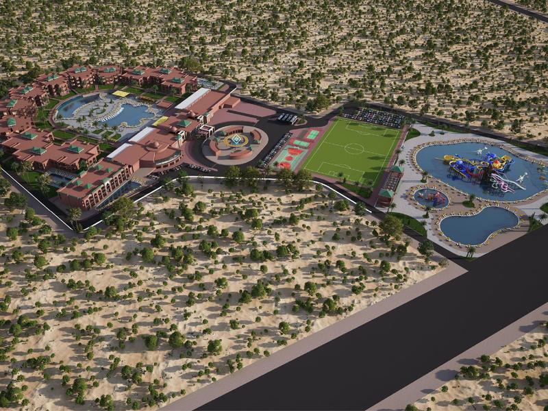 Veduta aerea di un grande resort nel deserto con piscina, campo da tennis e numerosi edifici.