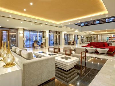 Bright, modern hotel lobby with cozy seating areas and elegant design.