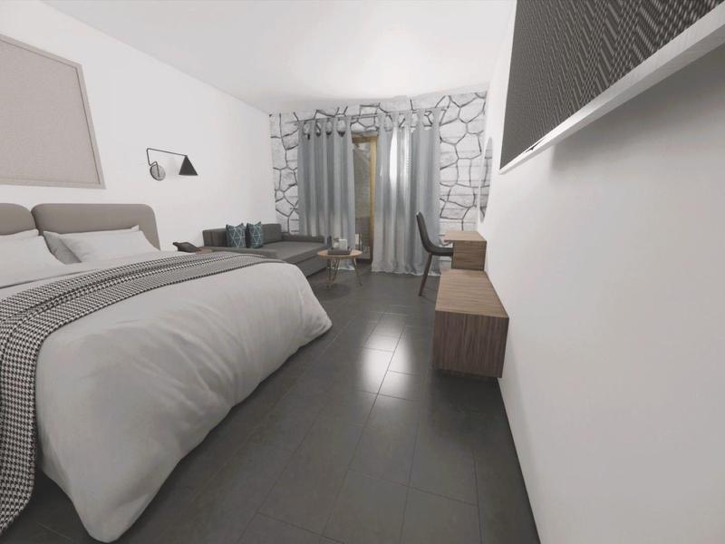 Modernes Hotelzimmer mit großem Bett, Sessel und Fenstervorhängen in neutralen Farben.