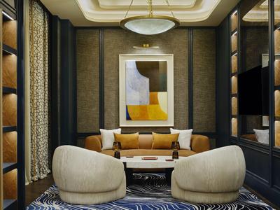 Salon élégant avec fauteuils beige-jaune, canapé, art abstrait et table basse ronde.