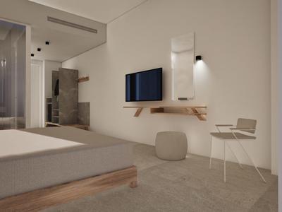 Modernly furnished hotel room with bed, wall monitor, and seating in neutral tones.