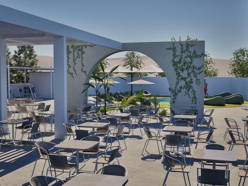 Modern outdoor terrace with tables, chairs, and green plants under a blue sky.