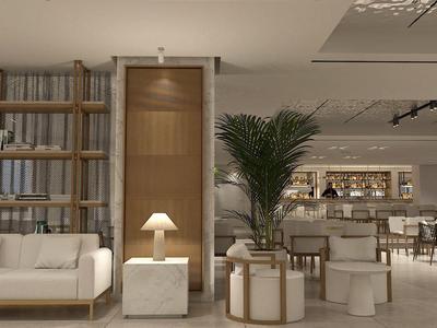 Moderner Hotel-Loungebereich mit bequemen weißen Sofas, Pflanzen und stilvollen Möbeln in neutralen Tönen.