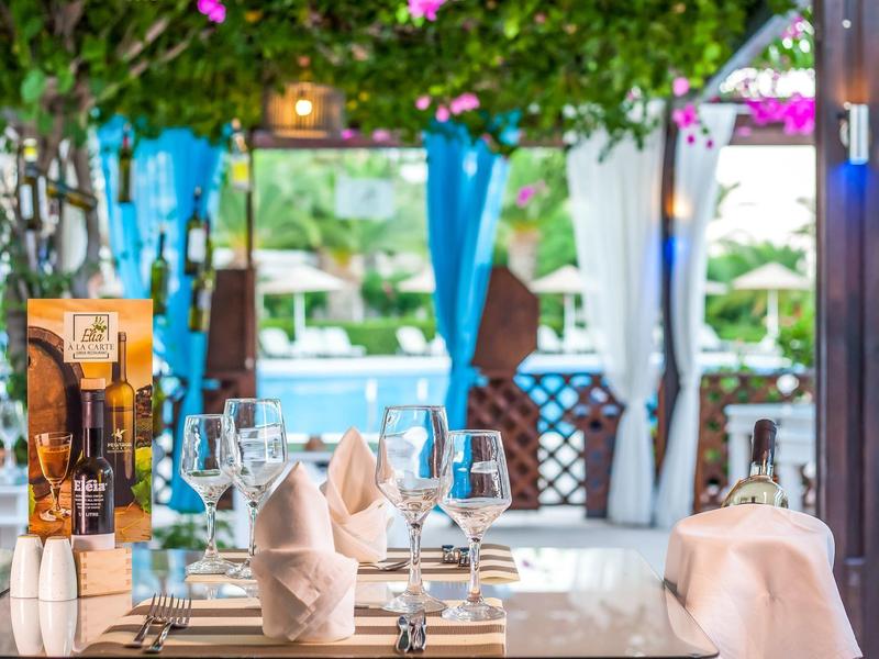Elegant table setting with glasses and folded cloth napkins in a hotel restaurant