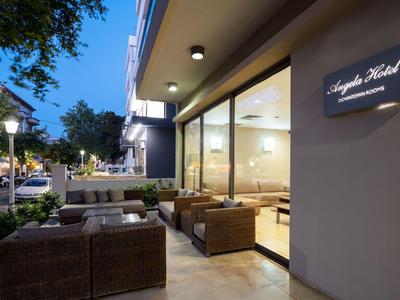 Outdoor seating area of a hotel with modern wicker furniture at dusk