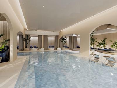 Moderní vnitřní bazén s průhlednými oblouky a relaxačními posezeními