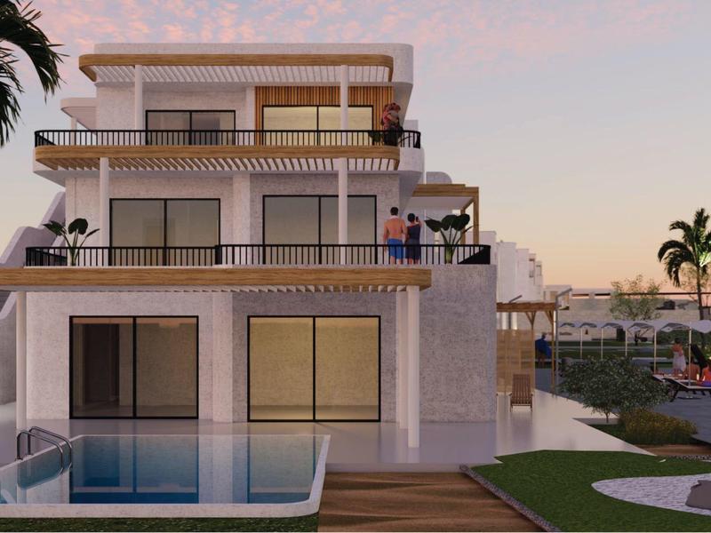 Modern multi-story house with terrace, pool, and palm trees at sunset.