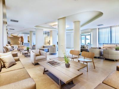 Spacious, modern hotel lobby with comfortable seating and abundant natural light.