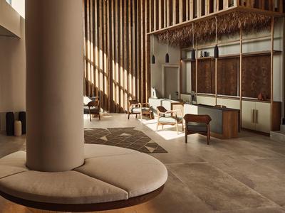 Moderne hotel lobby met ronde zitplaatsen en houten accenten.