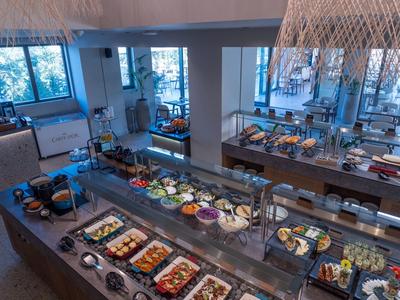 Spacious buffet with a variety of dishes in a modern hotel restaurant.