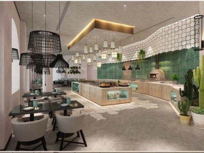 Modern restaurant met groene wanddecoratie, licht houten meubels en ruime zitgedeelte.