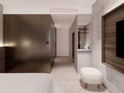 Modernly furnished hotel room with bed, wall-mounted TV, and stool.