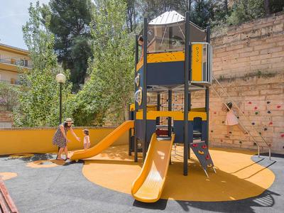 Children's playground with slides and climbing frame in an urban setting