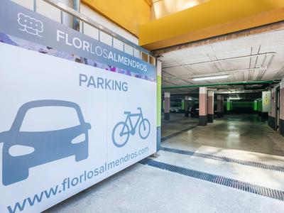 Entrance to underground parking with car and bicycle signs