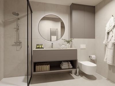 Baño moderno con lavabo, espejo redondo, inodoro y zona de ducha con mampara de vidrio.