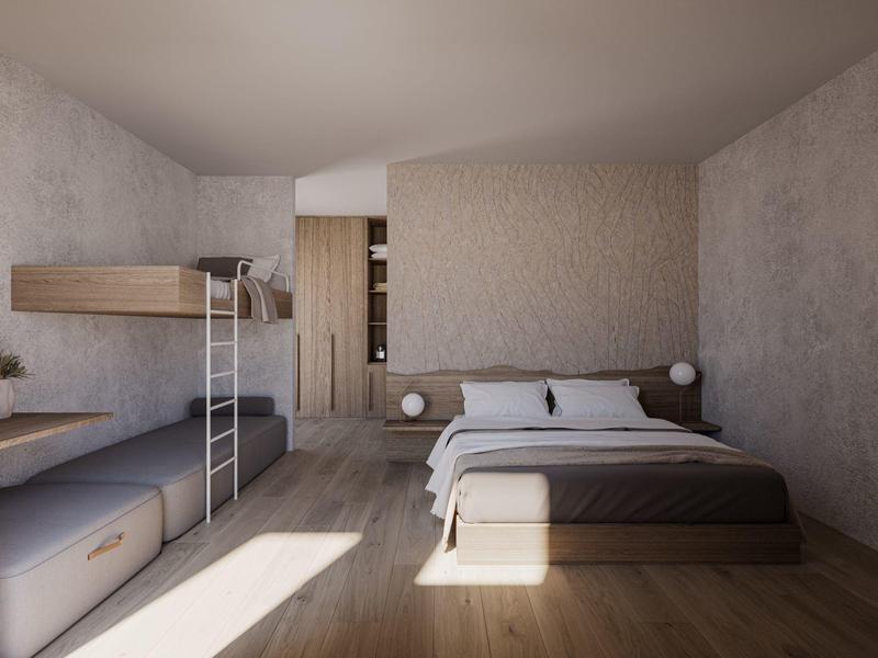 Chambre moderne avec lits superposés et lit double, décoration simple, sols en bois clair.