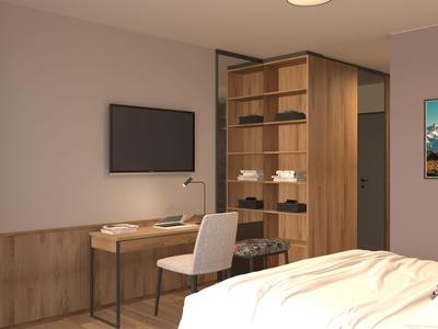 Modernes Hotelzimmer mit Schreibtisch, Stuhl, Fernseher und offenem Kleiderschrank.