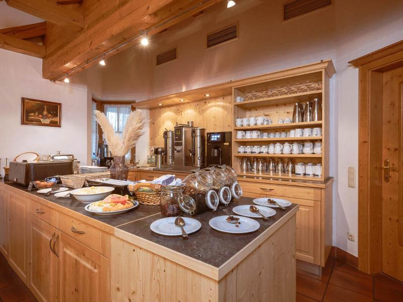 Cozy breakfast counter with dishes and food in a rustic setting.