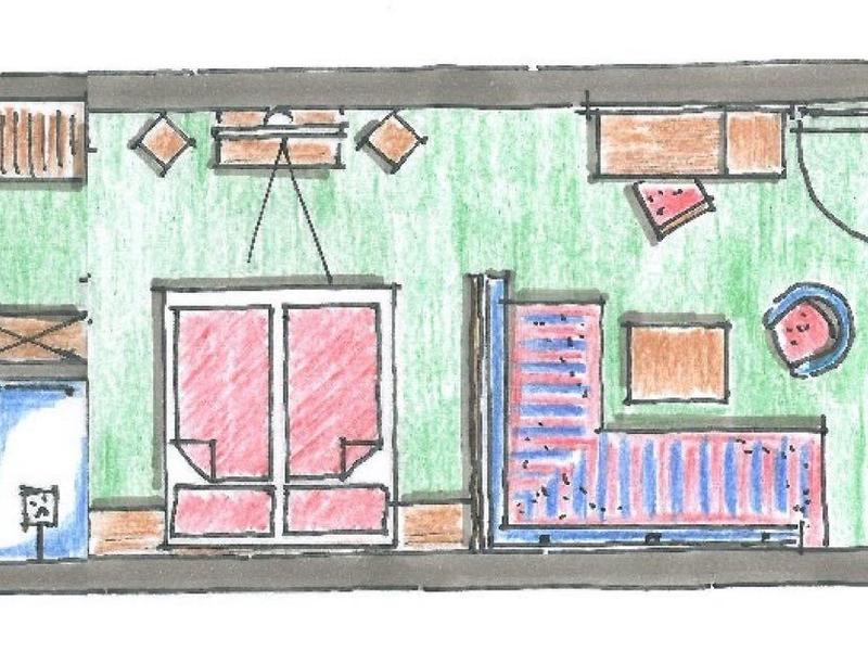 Wohnungsgrundriss mit Schlafzimmer, Bad, Küche, Wohnzimmer und großer Terrasse mit Möbeln.