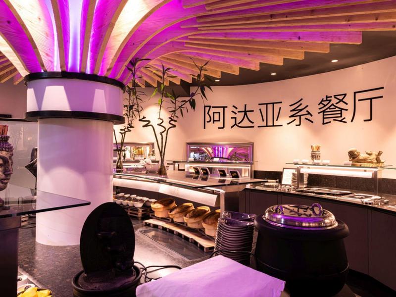 Modern Asian restaurant with decorative lighting and buffet area.