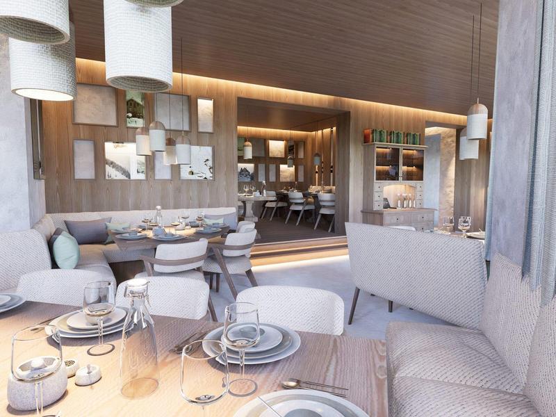 Modernes Hotelrestaurant mit gedeckten Tischen und gemütlicher Atmosphäre.