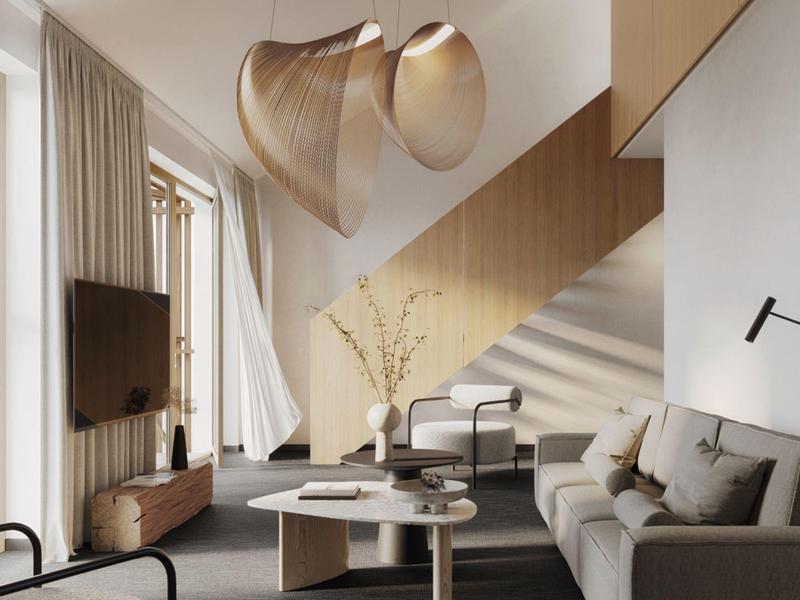 Soggiorno moderno con divano, tavolino e scala in una stanza luminosa