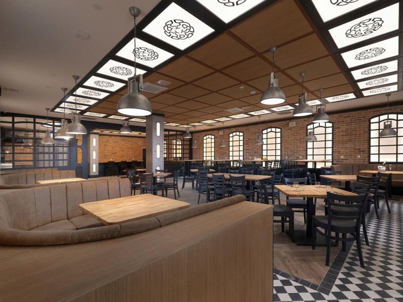 Modern eingerichteter Gastronomiebereich mit Holzmöbeln und geometrischem Fliesenmusterboden