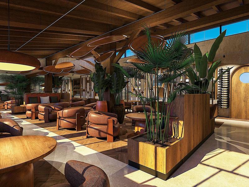 Jasna lobby hotelowa z drewnianymi akcentami, wygodnymi fotelami i dużymi roślinami w nowoczesnych wazonach.