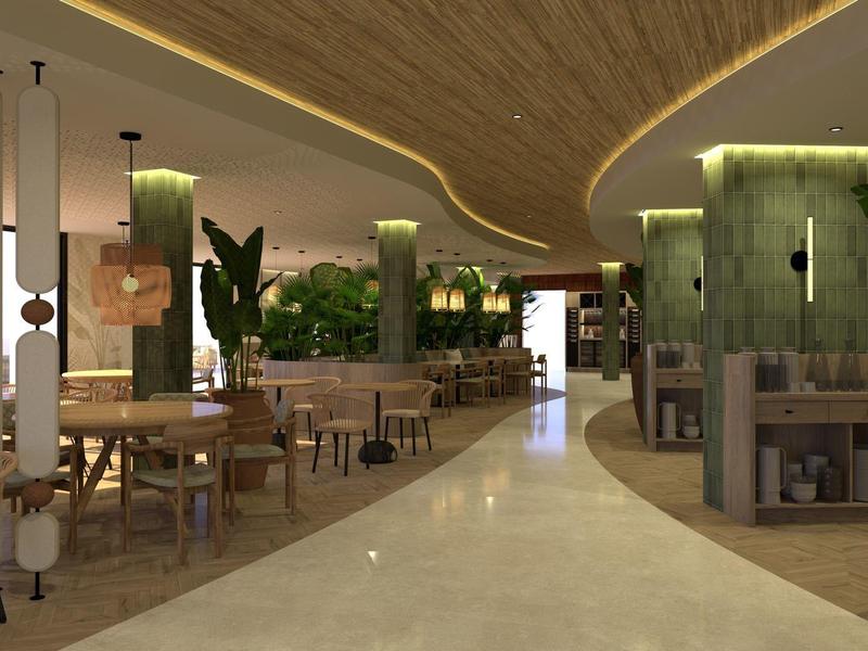 Nowoczesna strefa lounge hotelu z brązowymi fotelami, drewnianymi stołami i zielonymi roślinami