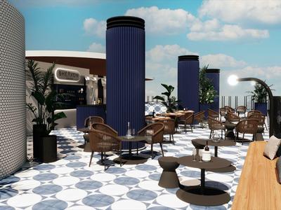 Moderner Hotelterrassenbereich mit runden Sesseln, Tischen und blau-weißen Bodenfliesen.