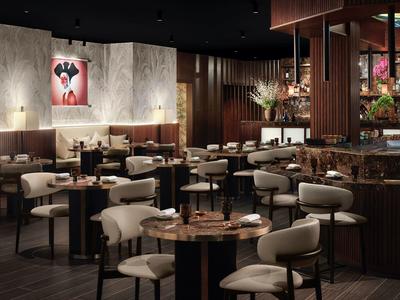 Modernes, stilvolles Restaurant mit dunklem Holz, runden Tischen und beigen gepolsterten Stühlen.